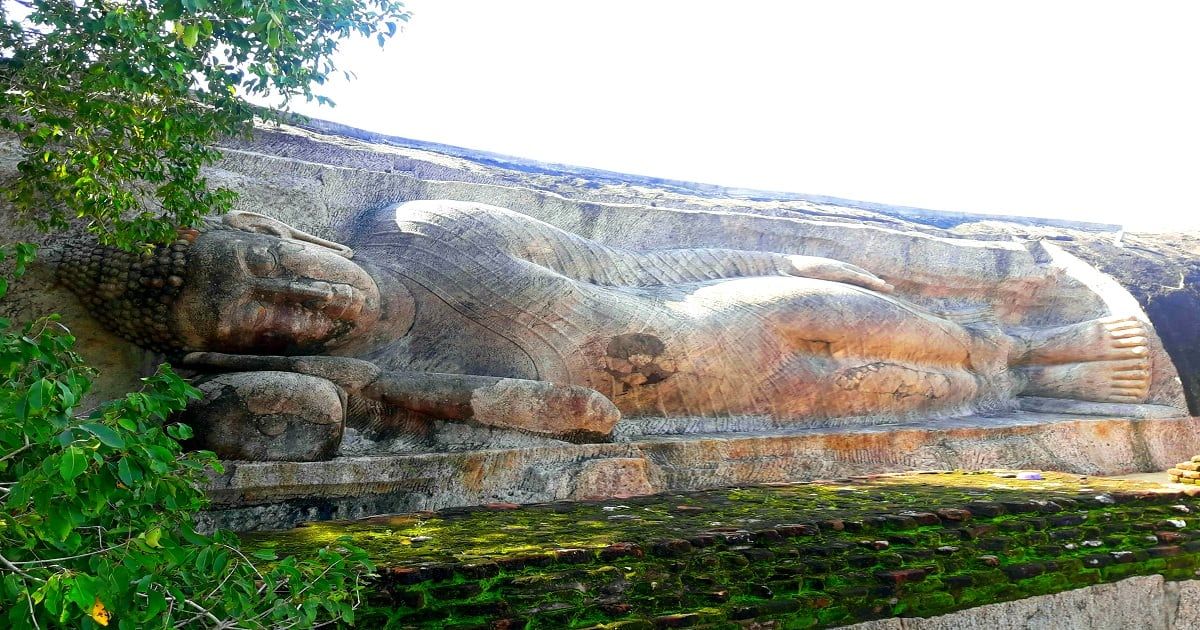 ancient sleeping Buddha statue in Thanthirimale